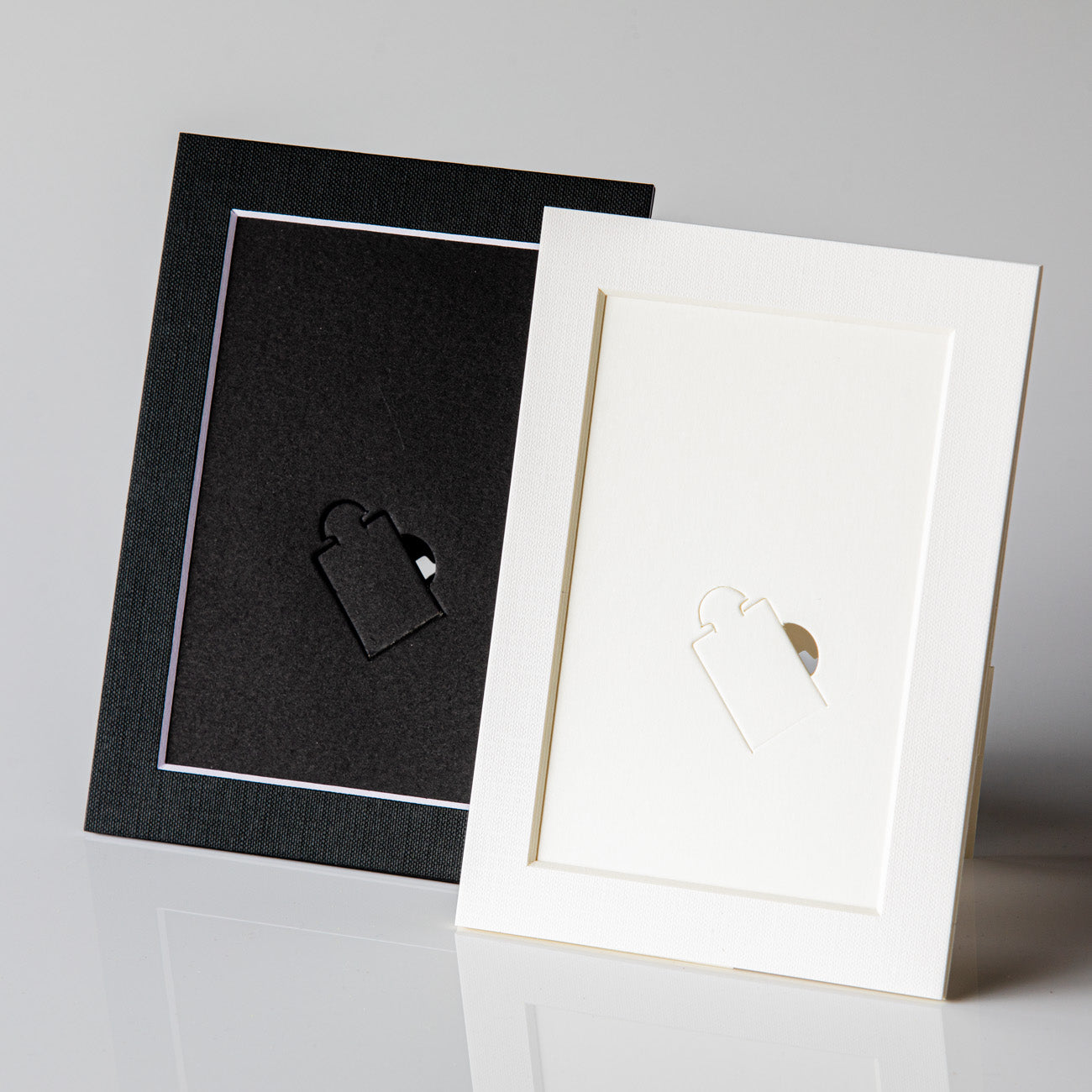 Each mount has its own built in stand on the back. Simply fold it out, click it in to place, and stand it up in a vertical OR horizontal position. Prints easily slide through a space at the side of the mount.