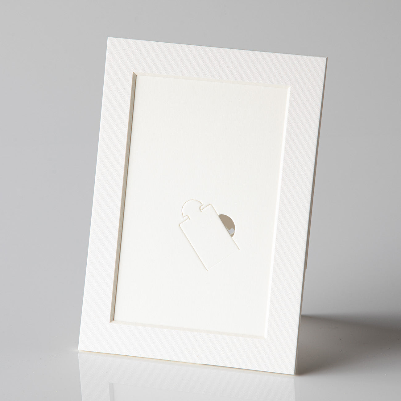 Each mount has its own built in stand on the back. Simply fold it out, click it in to place, and stand it up in a vertical OR horizontal position. Prints easily slide through a space at the side of the mount.