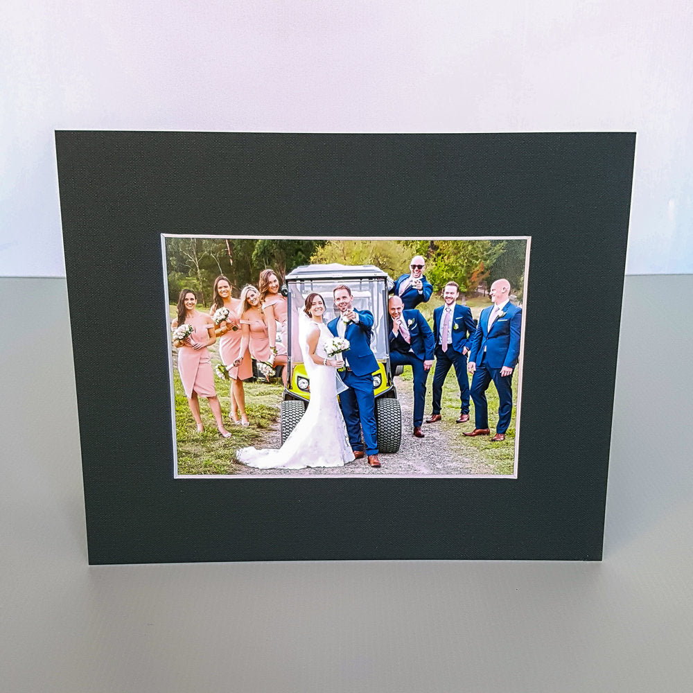 Each mount has its own built in stand on the back. Simply fold it out, click it in to place, and stand it up in a vertical OR horizontal position. Prints easily slide through a space at the side of the mount.