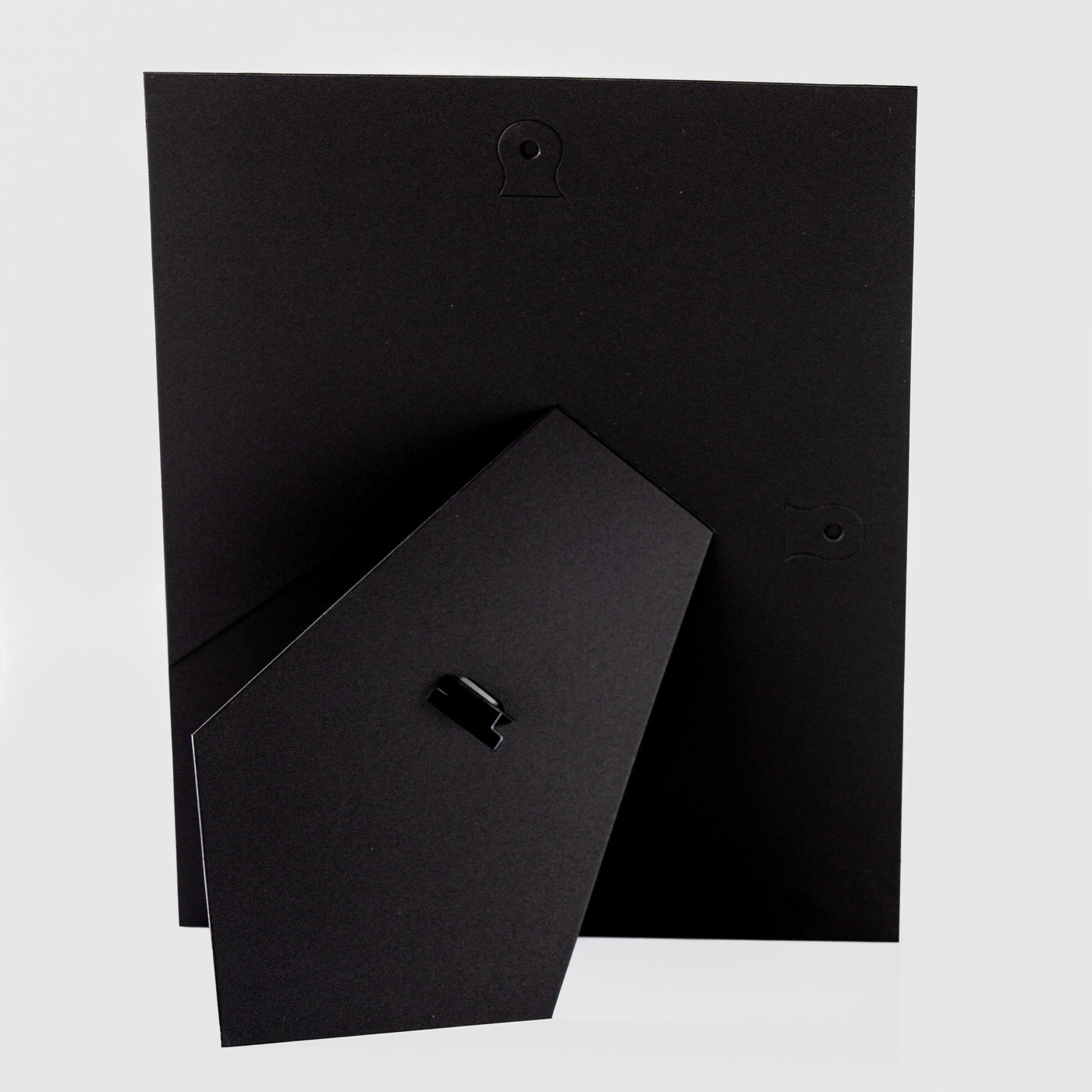 Each mount has its own built in stand on the back. Simply fold it out, click it in to place, and stand it up in a vertical OR horizontal position. Prints easily slide through a space at the side of the mount.