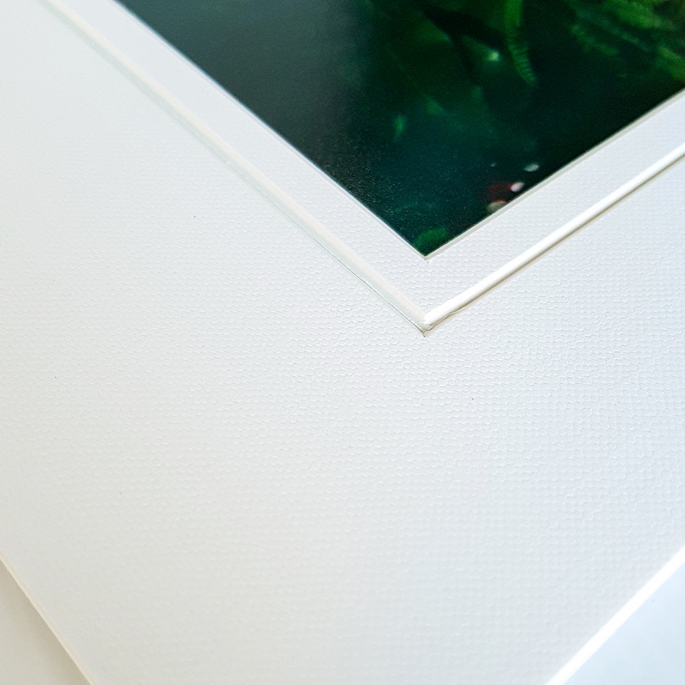 Each mount has its own built in stand on the back. Simply fold it out, click it in to place, and stand it up in a vertical OR horizontal position. Prints easily slide through a space at the side of the mount.